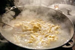 the process of cooking dumplings,open-air kitchen photo