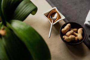 Pistachios in a wooden dish on the table photo