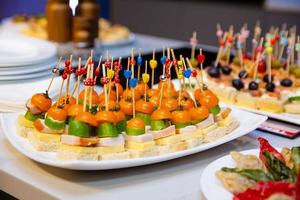 buffet table with snacks for guests photo