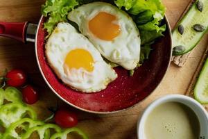 classic breakfast, scrambled eggs, simit bun, fresh vegetables, cucumber photo