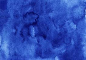 Watercolor dark blue background. Stains on paper. photo