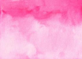 Watercolor light pink background stains on paper. Pastel rose color ombre backdrop. photo