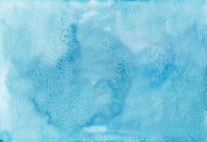 Watercolor light blue background painting texture. Vintage hand painted watercolour backdrop. Stains on paper. photo