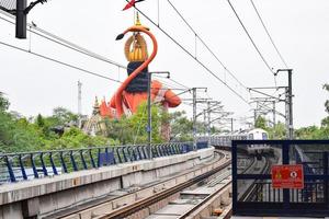 New Delhi India - June 21 2022 - Delhi Metro train arriving at Jhandewalan metro station in New Delhi, India, Asia, Public Metro departing from Jhandewalan station photo