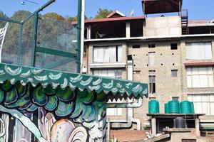 Early morning view of Modern rooftop restaurant at Kasauli, Himachal Pradesh in India, View of mountain hills from open air restaurant in Kasauli, Kasauli Rooftop restaurant photo