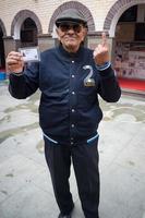 New Delhi, India - December 04 2022 - Unidentified people showing their ink-marked fingers after casting votes in front of polling booth of east Delhi area for MCD local body Elections 2022 photo