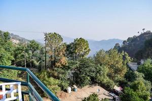 Early morning view of Modern rooftop restaurant at Kasauli, Himachal Pradesh in India, View of mountain hills from open air restaurant in Kasauli, Kasauli Rooftop restaurant photo