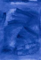 Watercolor dark blue background painting texture. Vintage indigo blue color watercolour backdrop. Stains on paper. photo