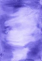 Watercolor royal purple background with space for text. Stains on paper photo