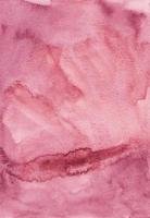 Watercolor dusty pink background texture painting. Vintage liquid crimson backdrop. Stains on paper. photo