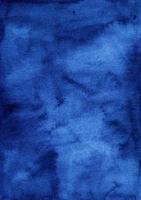 Watercolor dark blue background painting texture. Vintage deep royal blue color watercolour backdrop. Stains on paper. photo