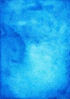 Watercolor deep azure blue background painting texture with space for text. Stains on paper. photo