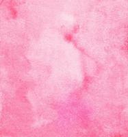 Watercolor light pink background painting. Watercolour pastel rose color soft backdrop. Stains on paper, hand painted. photo