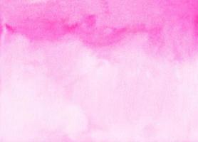 Watercolor light pink background stains on paper. Pastel rose color ombre backdrop. photo