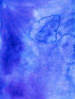 Watercolor deep blue-purple background. Stains on paper. Aquarelle royal purple liquid backdrop. photo