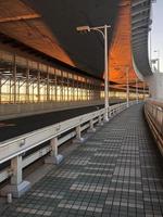 Sunlight and shadows on the Rainbow Bridge in Tokyo, Japan, in the evening hours photo