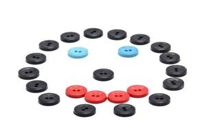 Plastic buttons of different colors. a smile from the buttons photo