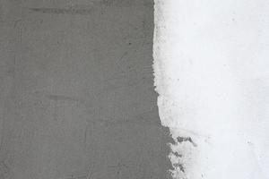 gris y blanco yeso pared superficie para textura o antecedentes foto