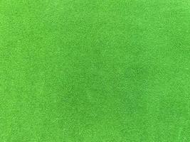 green velvet fabric texture used as background. Empty green fabric background of soft and smooth textile material. There is space for text. photo
