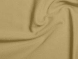 gold color velvet fblond color fabric background of soft and smooth textile material. There is space for text.Olive green fabric background of soft and smooth textile material. photo