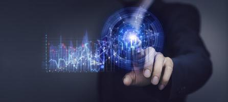 Businessman holding a graph goal of business Investor,analysis economic and calculates financial data and target for long-term investments and profitability in future on digital data system manager. photo