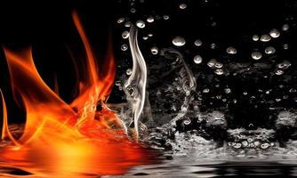 fire flames and water splash on black background photo