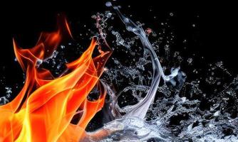 fire flames and water splash on black background photo