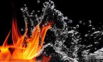 fire flames and water splash on black background photo