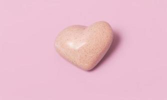 heart shape stone on plain background for valentines day photo