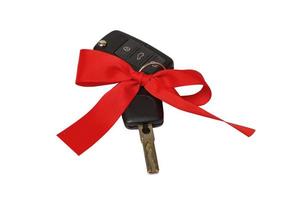 Gift key concept with red Bow on a white background photo