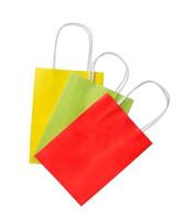 three shopping bags. Red, green and yellow color pacage on white background photo