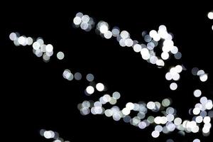 Abstract blur black and white bokeh background. many round light on background photo