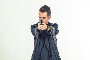 Man with handgun on white background. photo