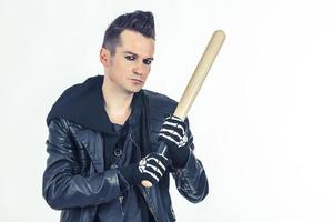 Hooligan with a baseball bat on white background. photo