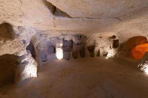 interior of an underground ancient city in Turkey in the Cappadocia region. photo