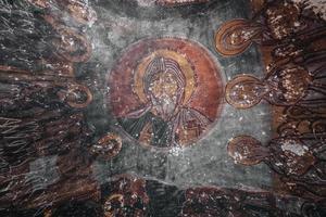 A cave church in Cappadocia with inscriptions on the walls, frescoes from the beginning of Christianity. photo