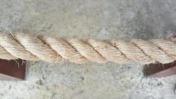 Close up of ropes with concrete floor in background photo