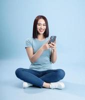 Image of young Asian woman posing on background photo