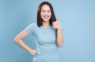 Image of young Asian woman posing on background photo