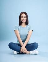 Image of young Asian woman posing on background photo