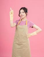 Young Asian woman housewife on background photo