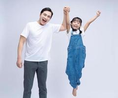 Image of Asian father and daughter on background photo