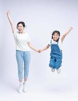 Image of Asian mother and daughter on background photo