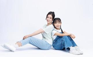 Image of Asian mother and daughter on background photo