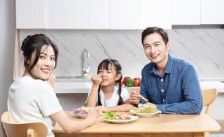 Image of Asian family in the kitchen photo