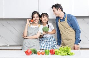 Image of Asian family in the kitchen photo