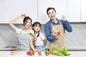 Image of Asian family in the kitchen photo