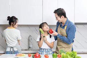 Image of Asian family in the kitchen photo