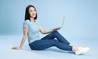 Image of young Asian woman posing on background photo