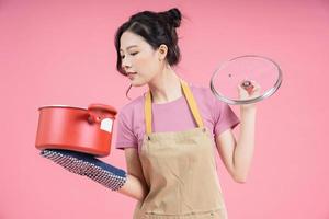 Young Asian woman housewife on background photo